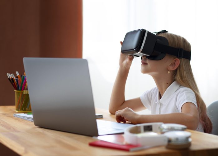 little girl using virtual reality goggles