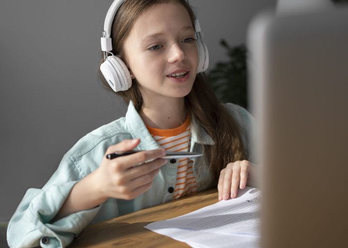 side view girl learning with laptop